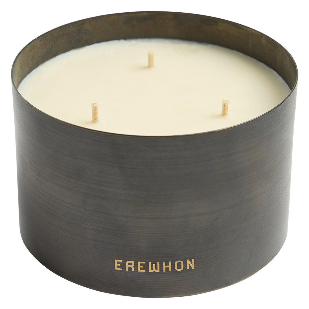 Candle in a black container with 'Erewhon' branding on a white background