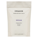 A package of Erewhon Premium Bath Salts in the Uplift variant, featuring magnesium flakes with rose geranium and bergamot.