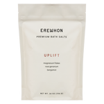 A package of Erewhon Premium Bath Salts in the Uplift variant, featuring magnesium flakes with rose geranium and bergamot.
