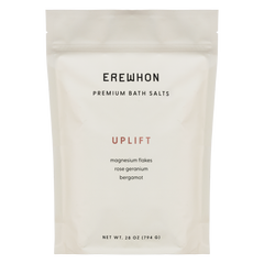 A package of Erewhon Premium Bath Salts in the Uplift variant, featuring magnesium flakes with rose geranium and bergamot.