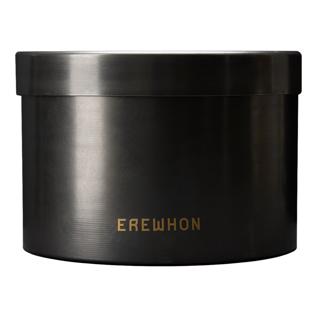 A black steel candle vessel with the brand name 'EREWHON' written on it