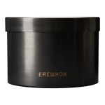 A black steel candle vessel with the brand name 'EREWHON' written on it