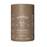 A jar of Chocolate Cowboy Colostrum, a rich and creamy blend of first-milking colostrum with organic cacao, monk fruit, and sea salt for balanced flavor.