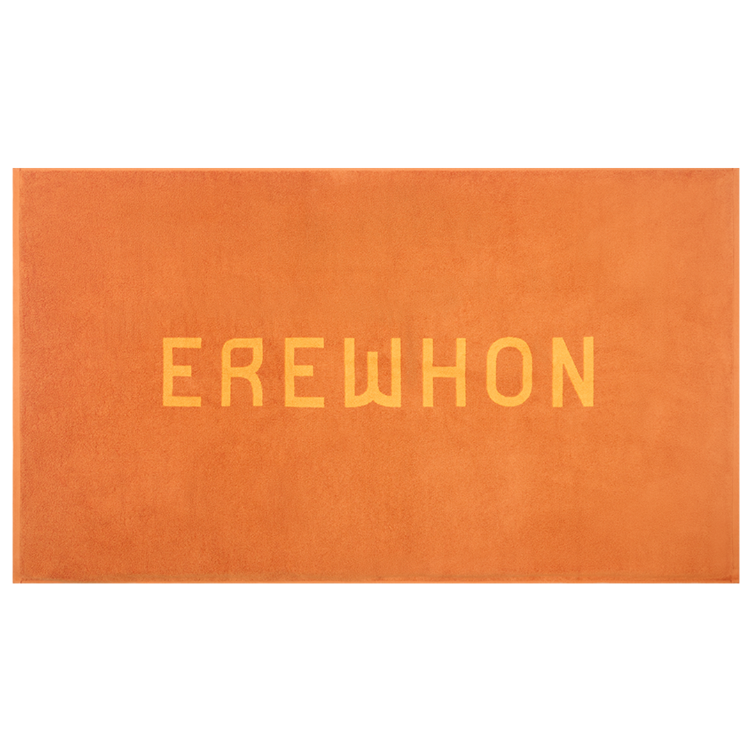 Orange beach towel 'EREWHON' text on a white background