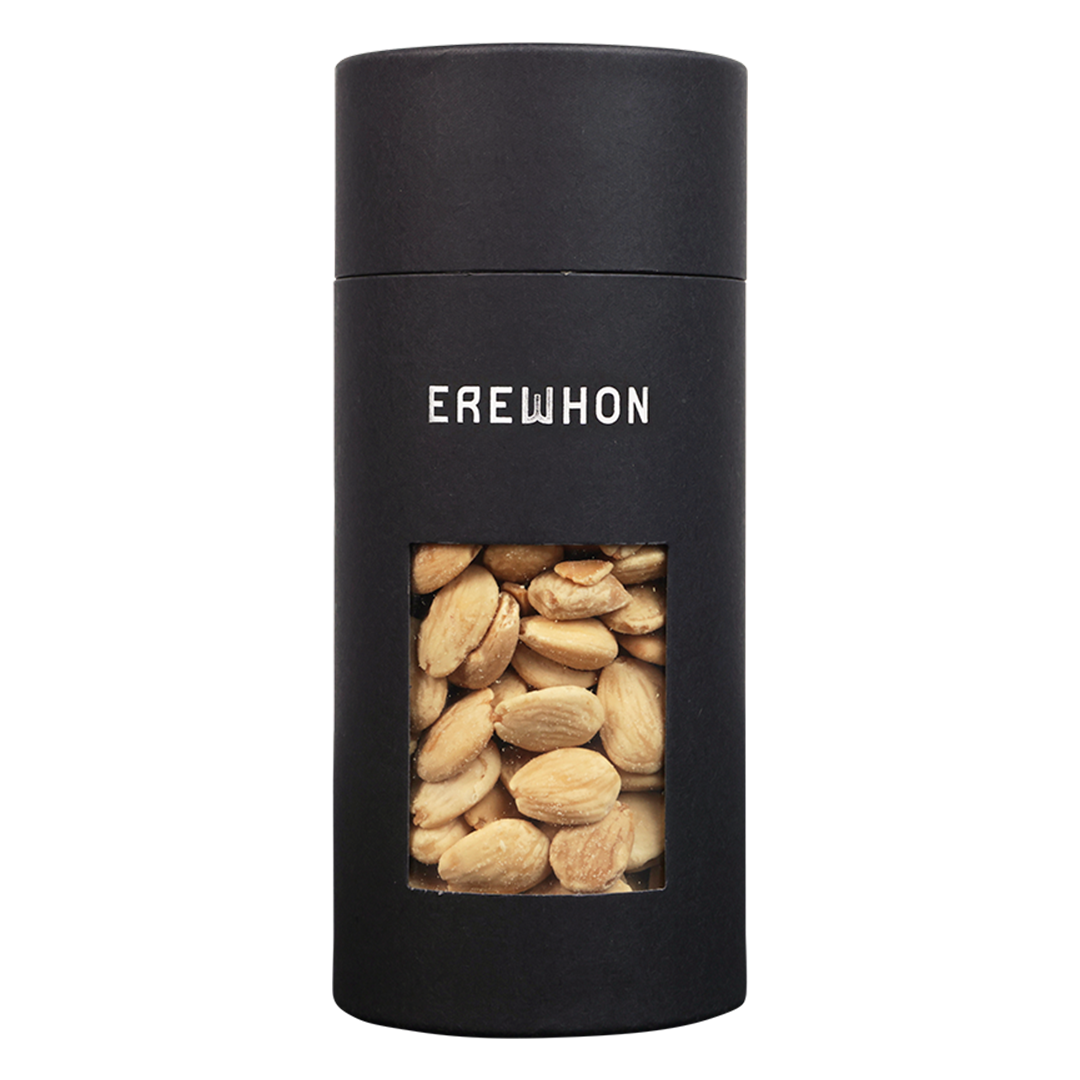 A sleek black canister of Erewhon Marcona Almonds with a clear window showing the almonds inside.