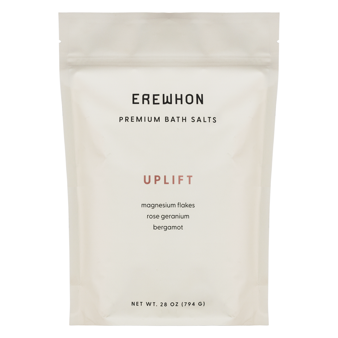 A package of Erewhon Premium Bath Salts in the Uplift variant, featuring magnesium flakes with rose geranium and bergamot.