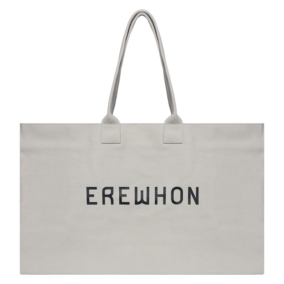 Erewhon Weekender Bag XL in Natural, 15" x 25" x 9", made from 100% organic cotton with eco-friendly dyes, featuring durable handles and minimalist black print.